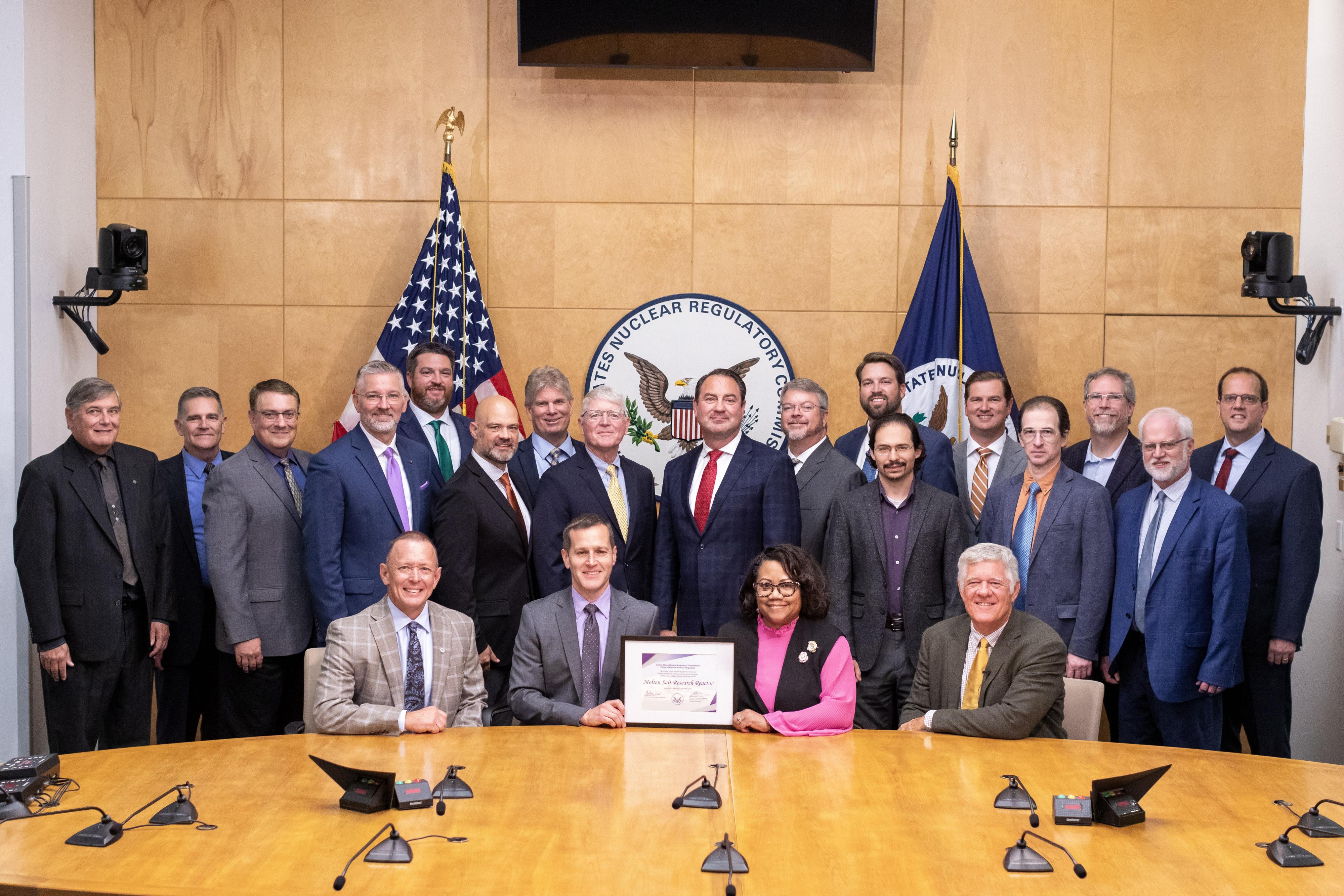  Representatives from Natura Resources, the Zachry Group, Abilene Christian University, The University of Texas at Austin, Texas A&M University, and the Georgia Institute of Technology receive the issued Construction Permit at the Nuclear Regulatory Commission. (Image credit – Natura Resources LLC)