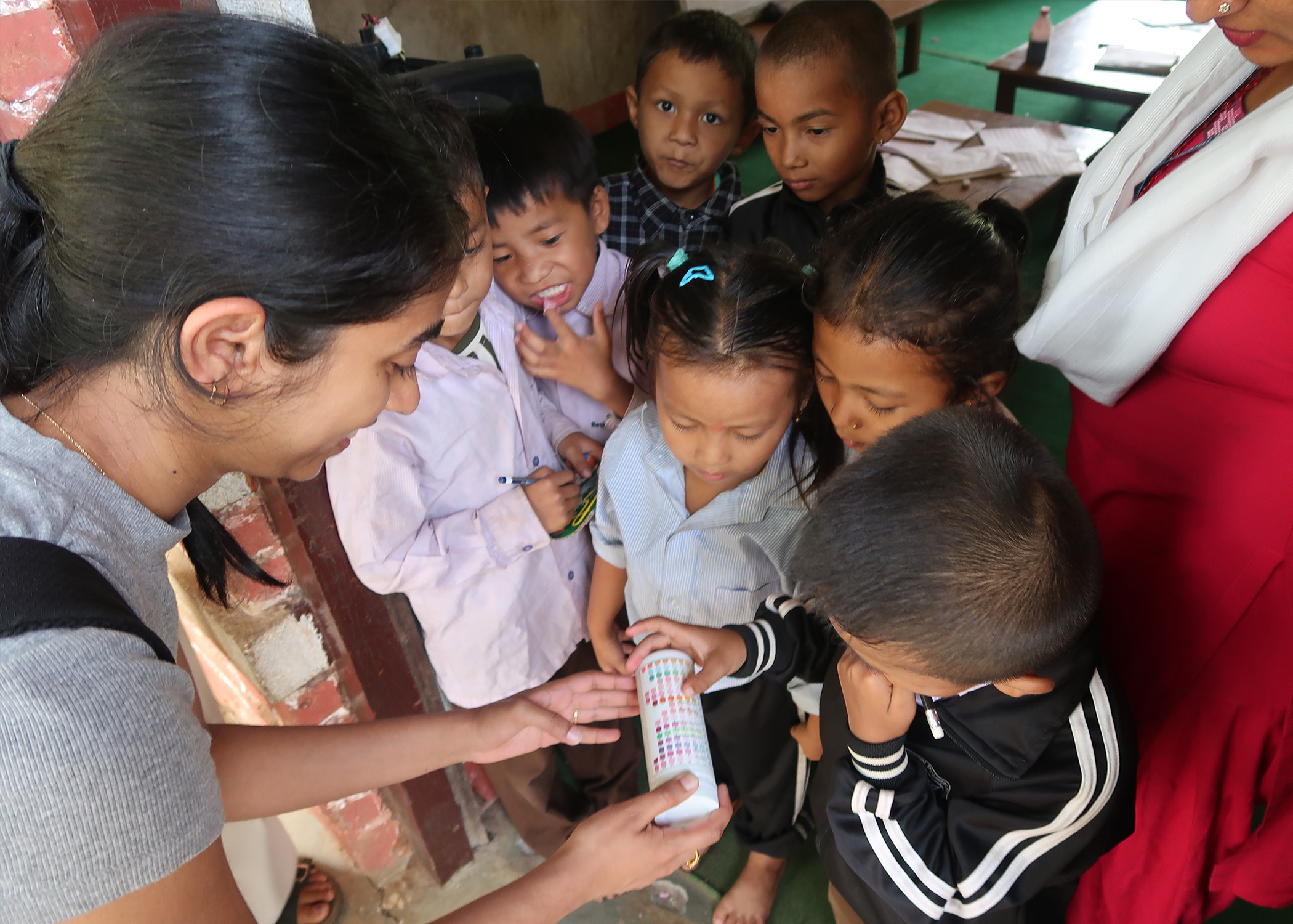 Devasena Sitaram shares with the village schoolchildren about water testing strips.