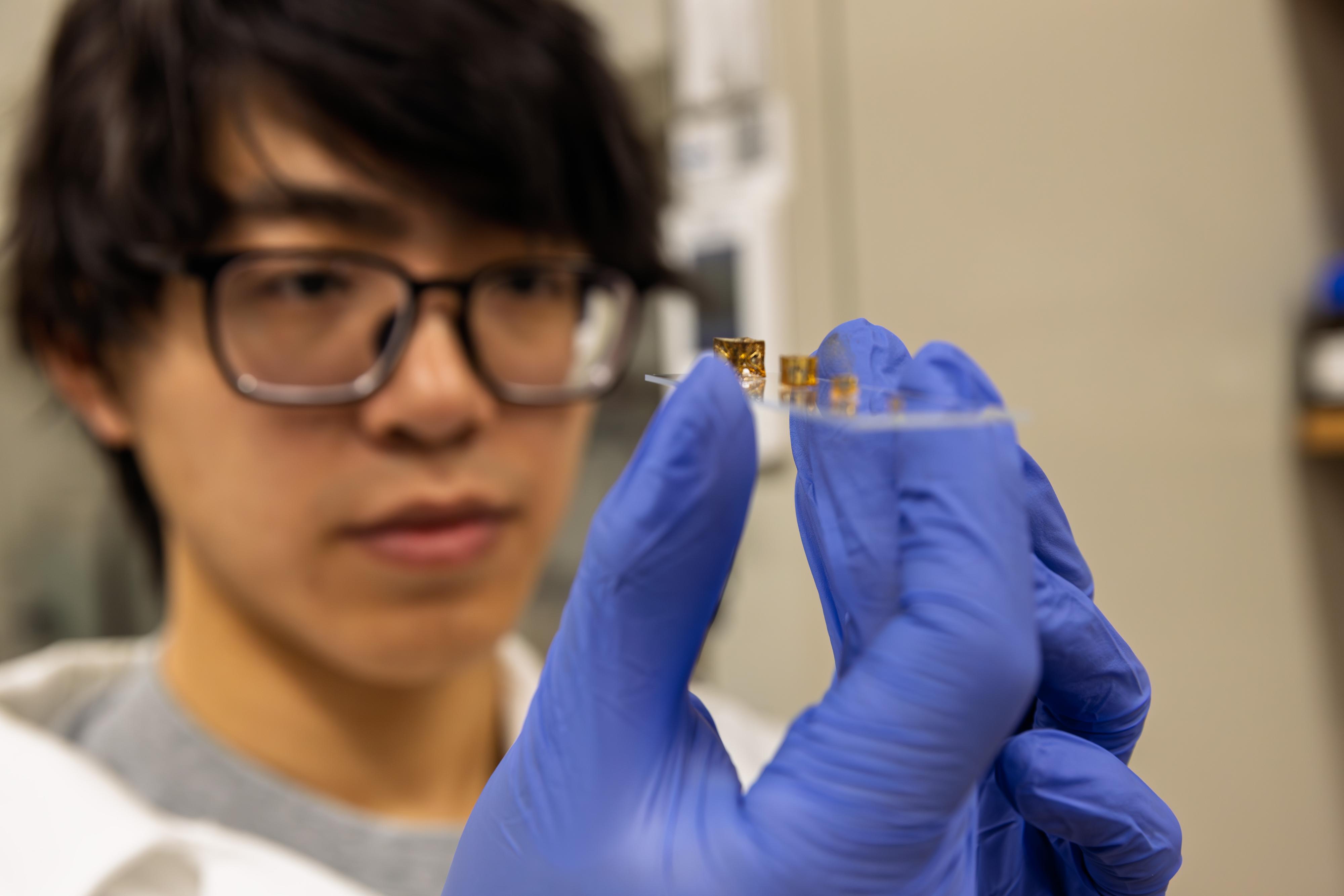 Student conducting research in Yuhang Hu's lab