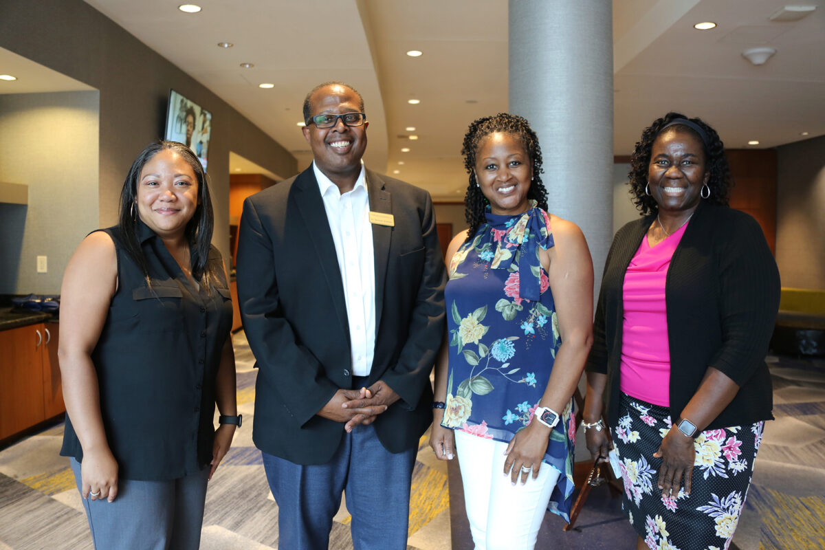 Lula Baker, Ann Lamb, and Melody Foster with School Chair Samuel Graham