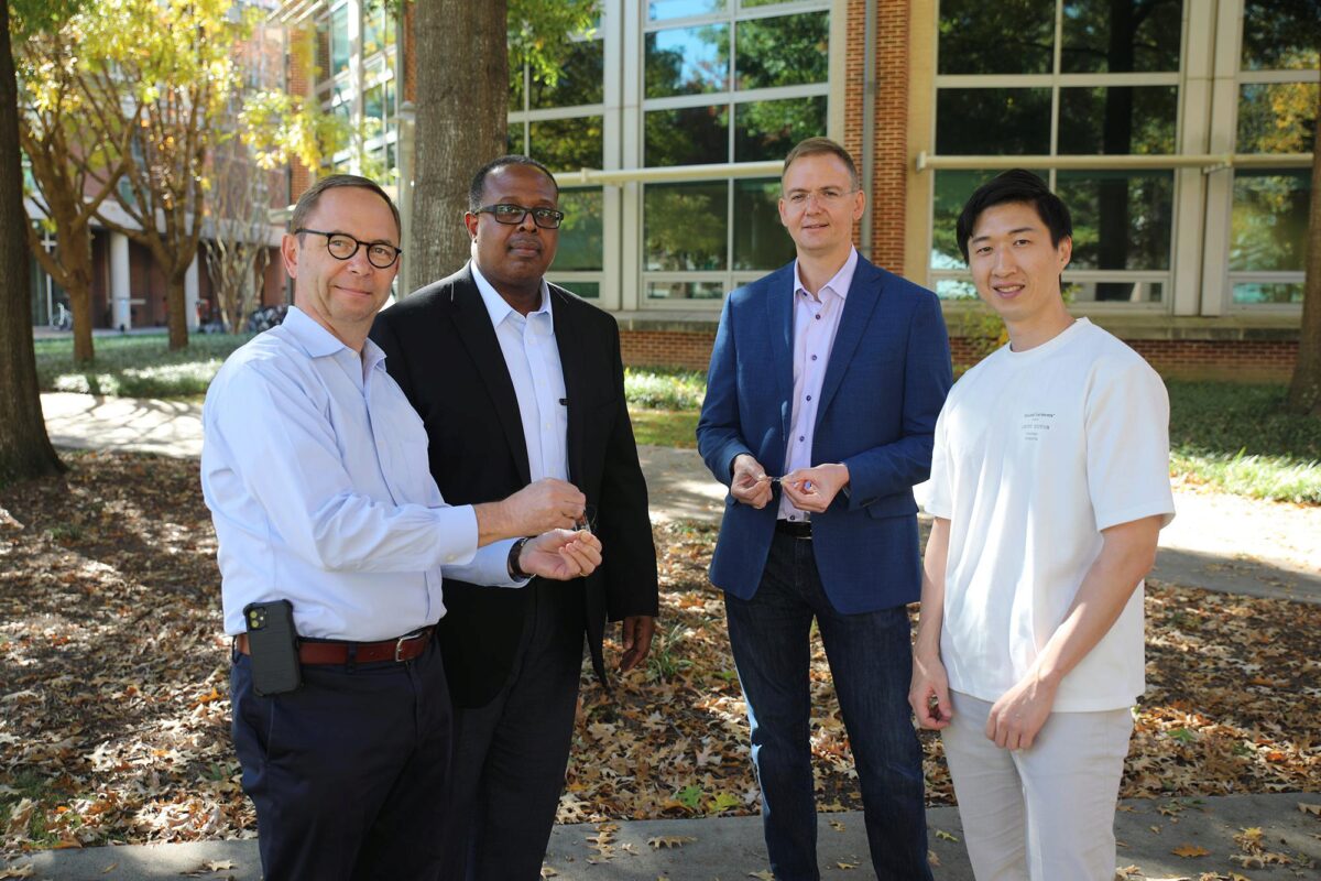 Four researchers posing with their soft sensor.