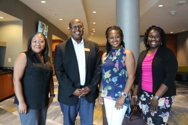 Lula Baker, Ann Lamb, and Melody Foster with school chair Samuel Graham