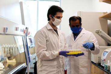 Professor Ankur Singh (right) with graduate student Chris Carlson, second author of the Nature Materials paper.