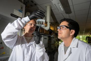 Erik Barbosa and Madeline Morrell examine salt beads. 